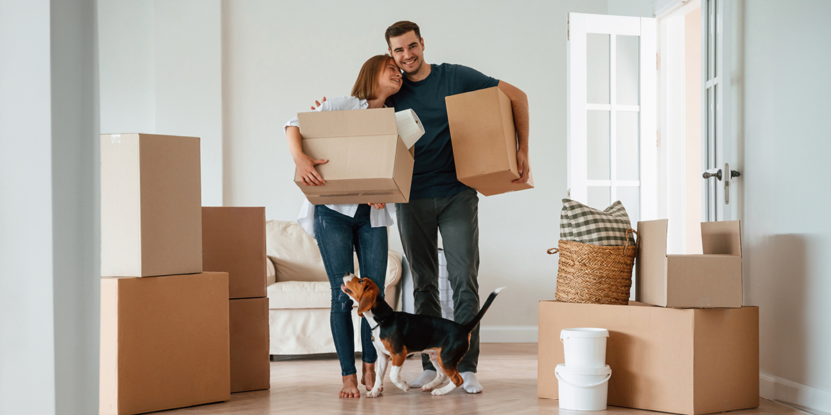 Couple holding keys to their new house.